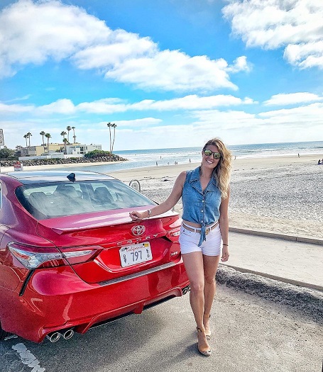 Amanda Balionis with her Toyota Red Camry